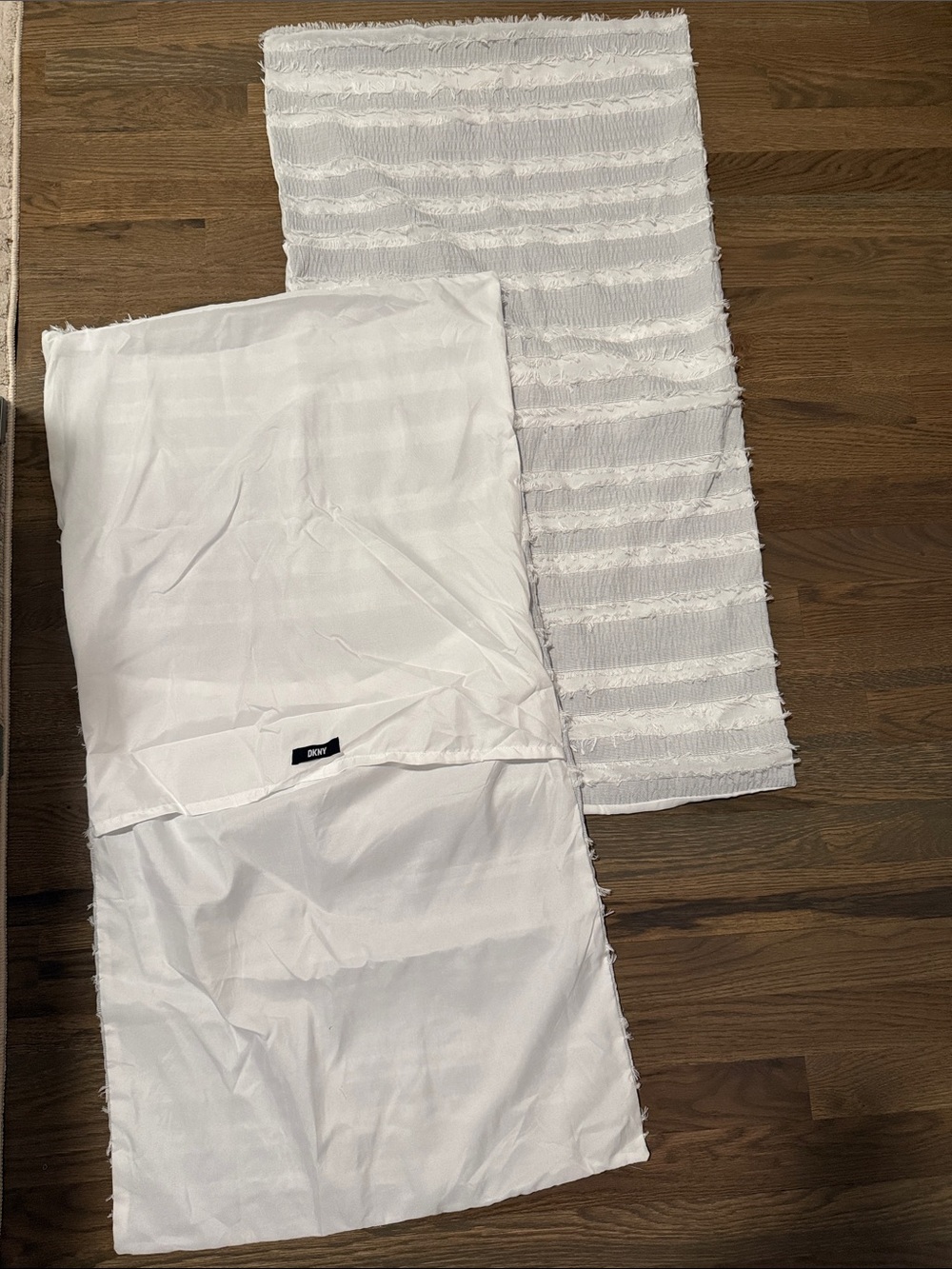 2 white DKNY king size pillow shams!
